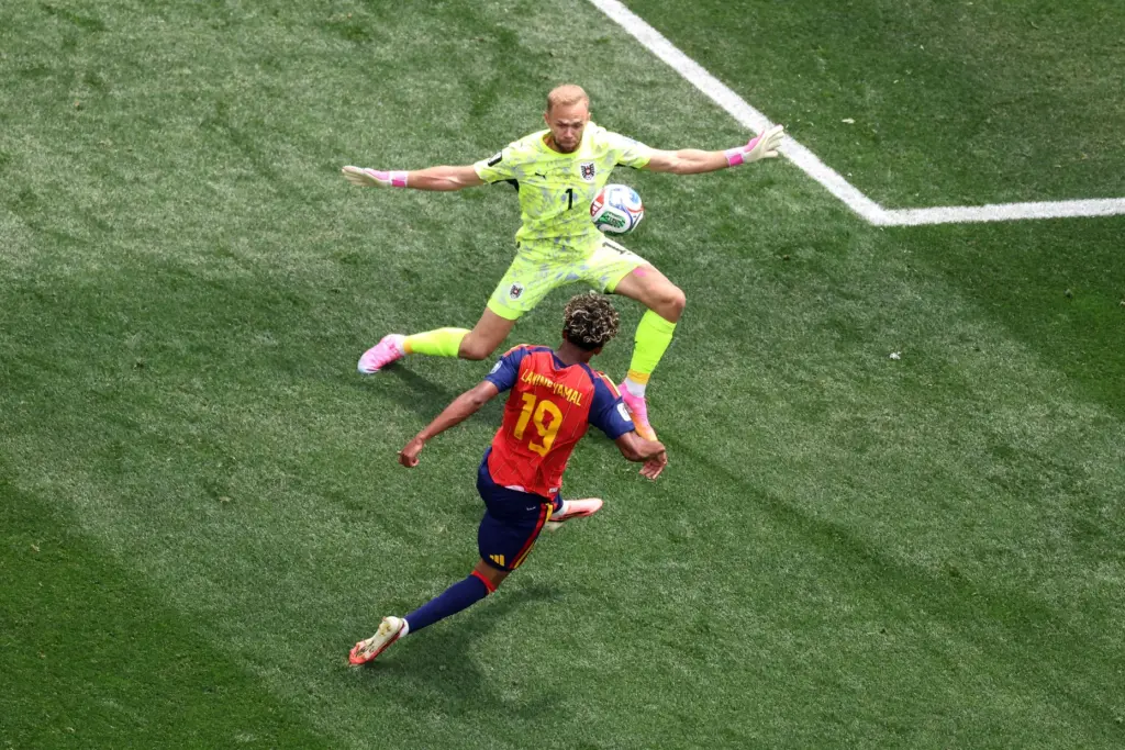 Spain forward Lamine Yamal (19) takes a goal shot against...