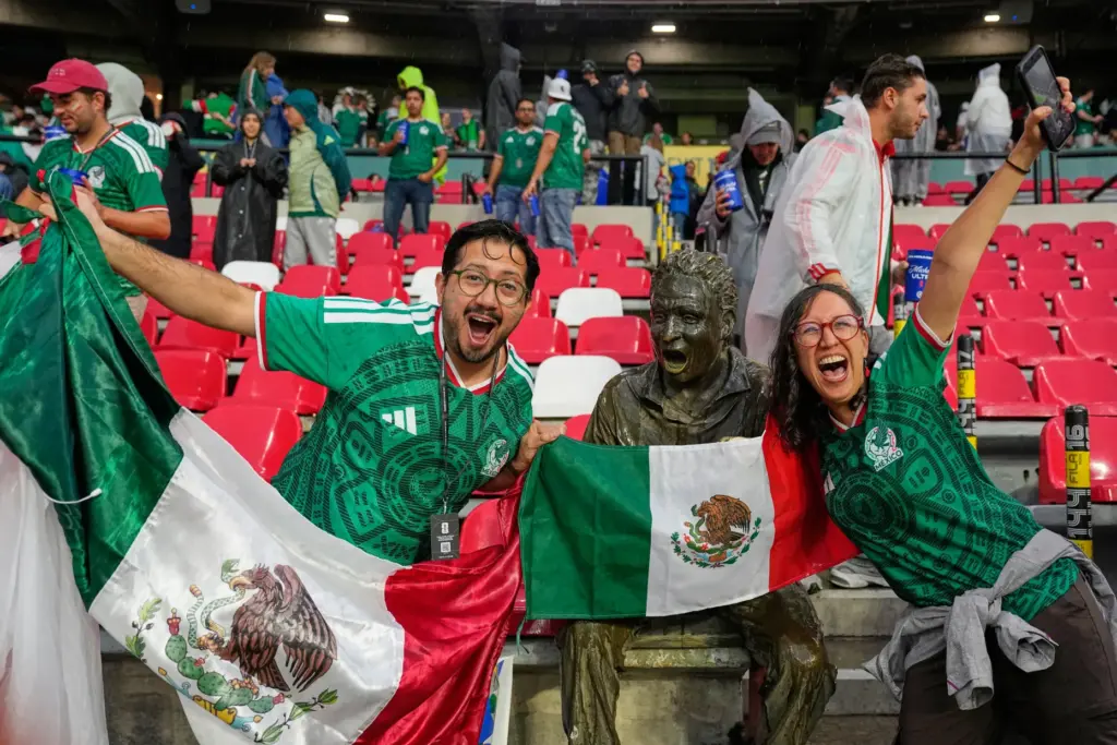 Mexican fans react ahead of the World Cup round of...