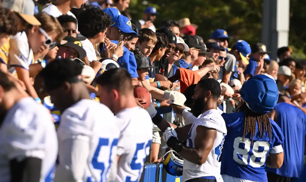 Rams sign autographs on the first day of training camp...