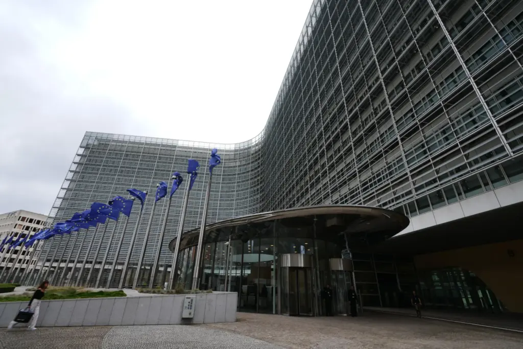 European Union flags flap in the wind outside EU headquarters in Brussels.