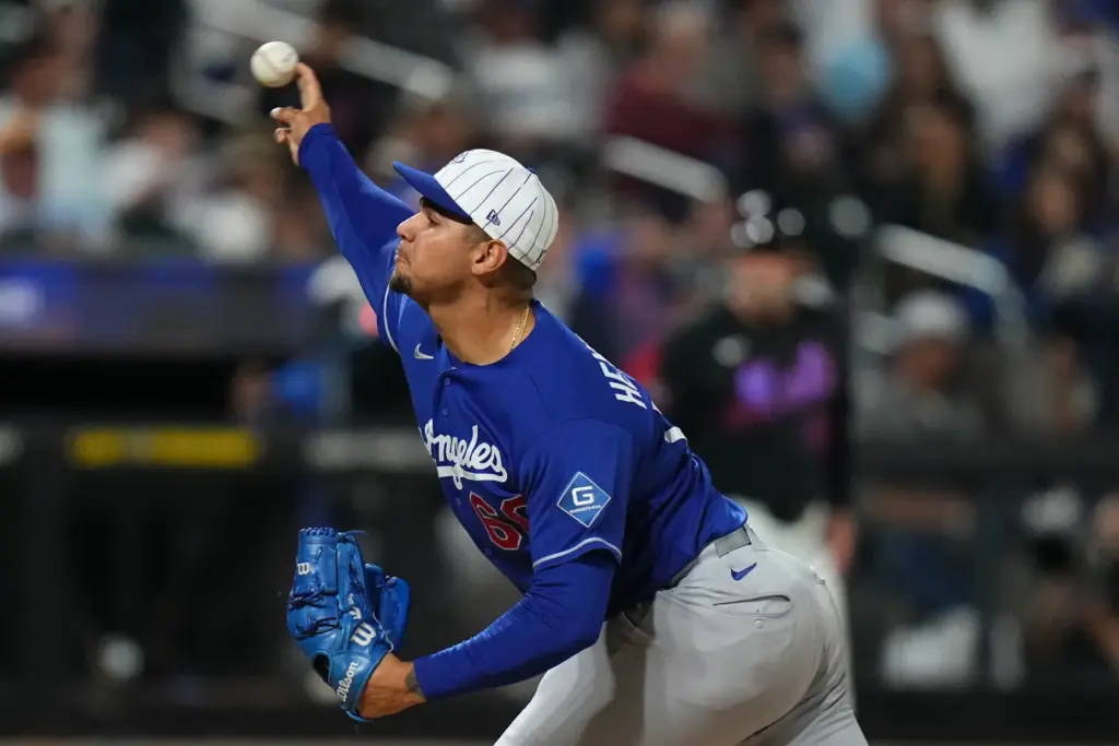Dodgers’ Edgardo Henriquez pitches deighth inning of a baseball game...