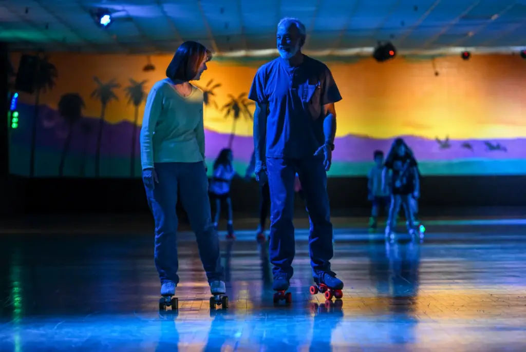 Skaters roll around the rink at Holiday Skate Center in...