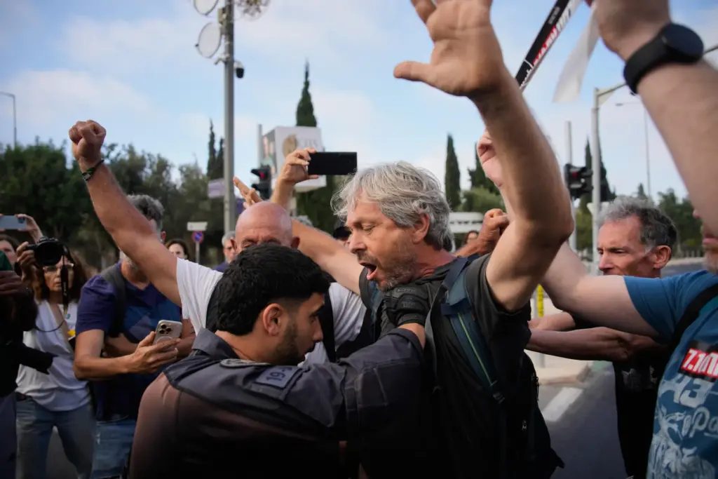 Police disperse demonstrators during a protest marking 1,000 days since...