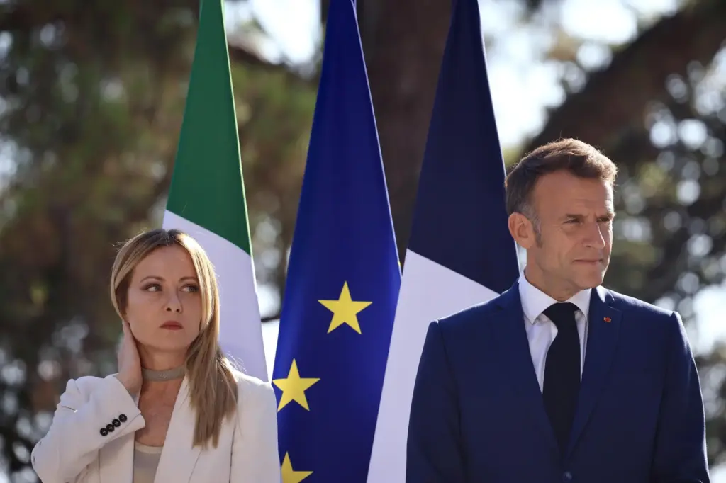 Italian Prime Minister Giorgia Meloni attends a news conference with French President Emmanuel Macron.