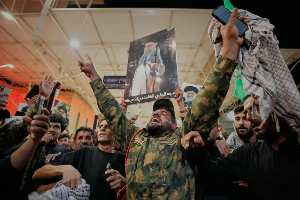 An Iraqi Shiite soldier chants on the eve of funeral ceremonies.