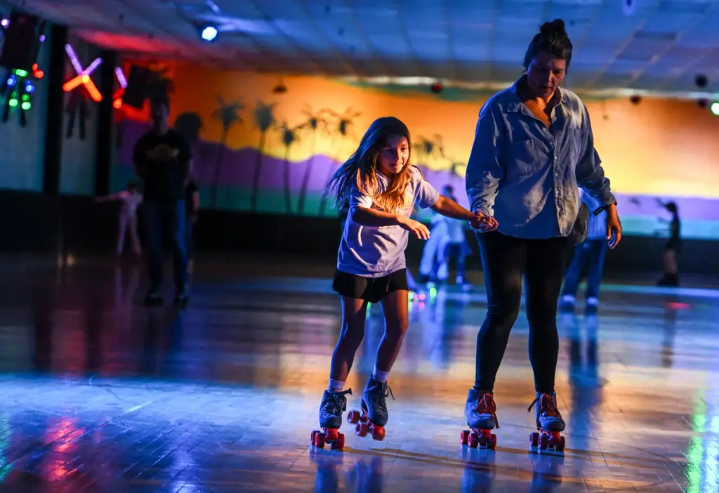 Briana Klistoff skates with her daughter, Ella Hanson, 7, at...