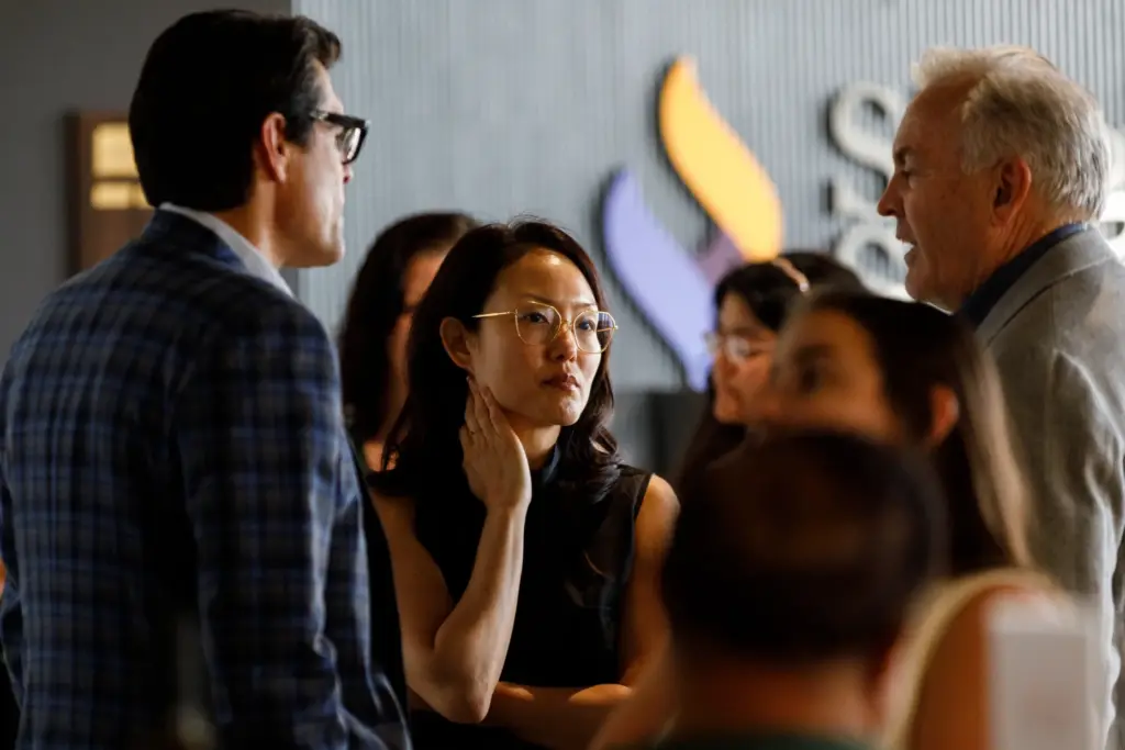 Insurance commissioner candidate Jane Kim speaks with guests at the...