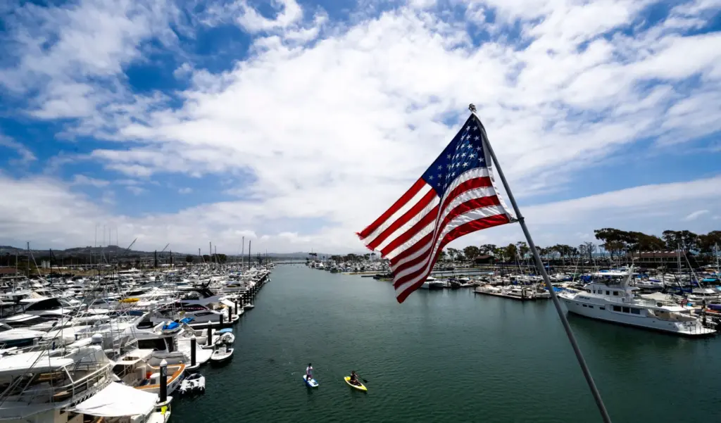 Paddleboarders make their way around the harbor in Dana Point...