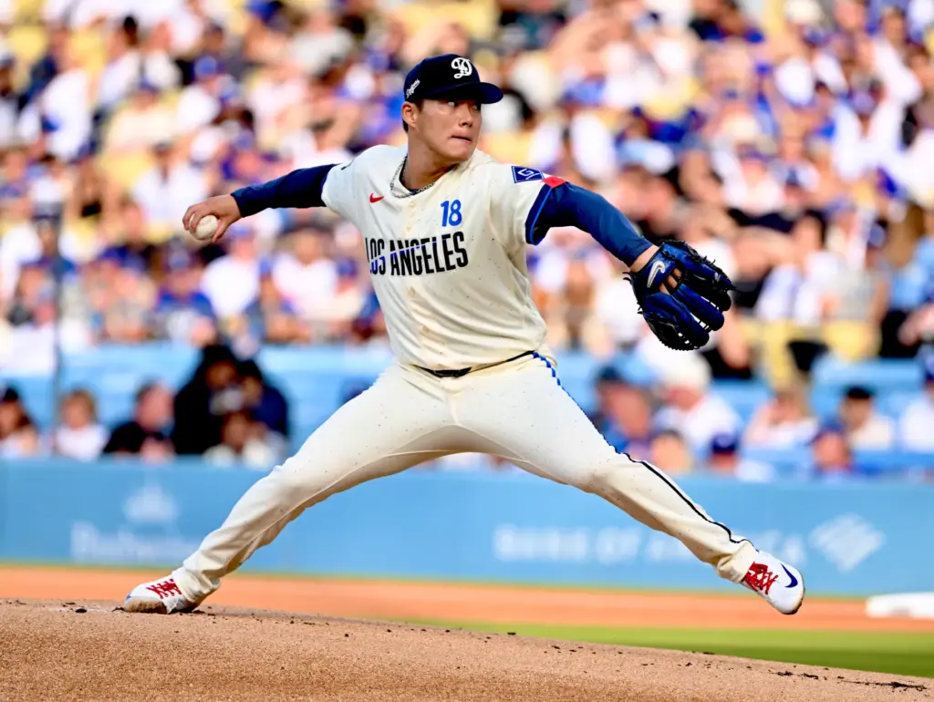 Starting pitcher Yoshinobu Yamamoto of the Dodgers throws to the...