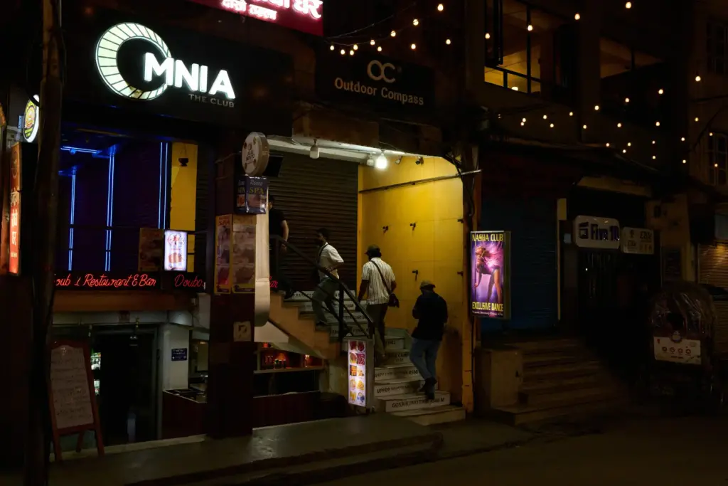 Men enter a club in Kathmandu, Nepal, Thursday, May 21,...