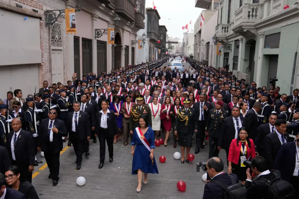 Peru’s President Keiko Fujimori walks to the presidential palace after...