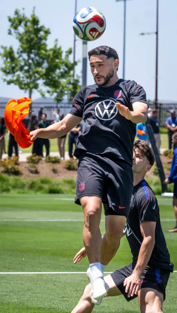 U.S. Menâs National Team member Christian Roldan practices with his...