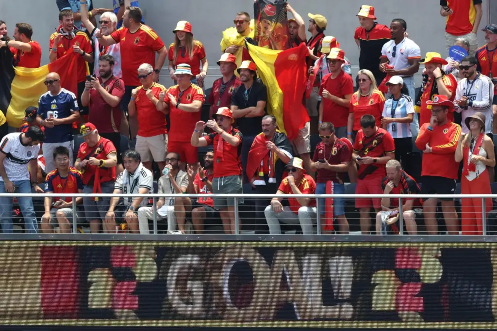Belgium fans cheer after their team scores a goal against...