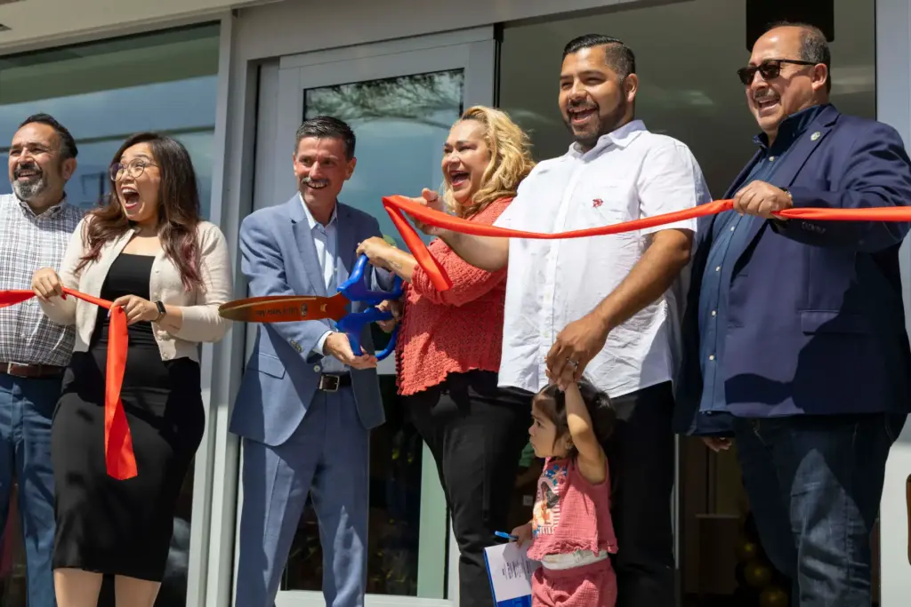 Santa Ana City Council members cut the ribbon to celebrate...