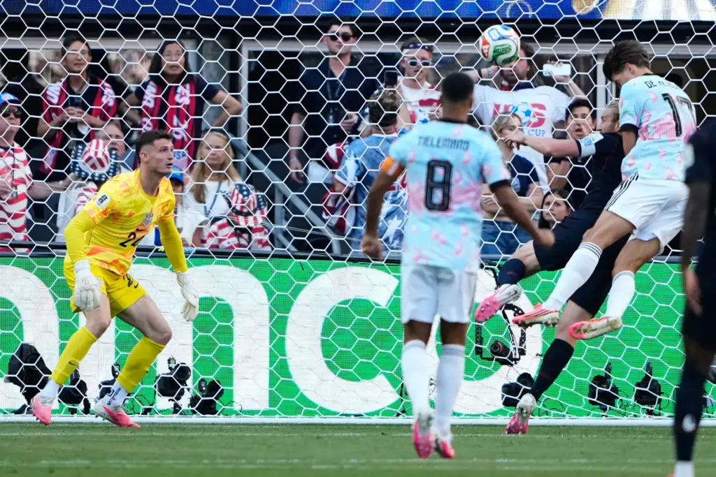 Belgium’s Charles De Ketelaere (17) scores his team’s second goal...