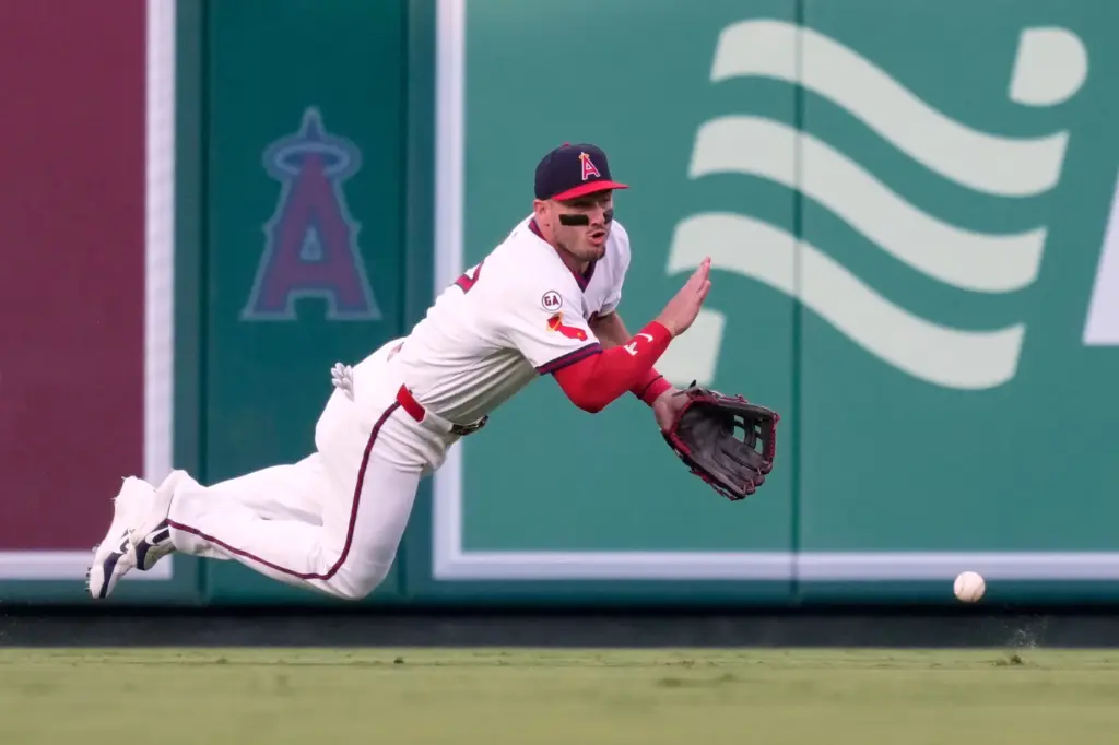 Angels center fielder Mike Trout can’t handle a ball hit...