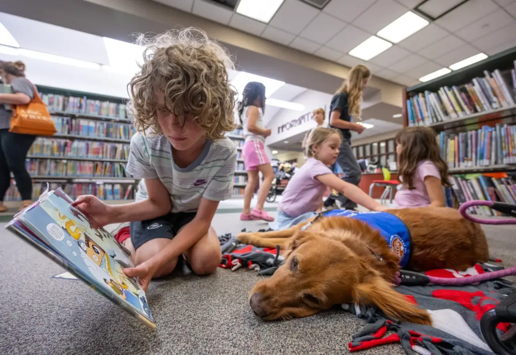 Logan Kalscheuer, 9, of Ladera Ranch, reads a childrenâs book...