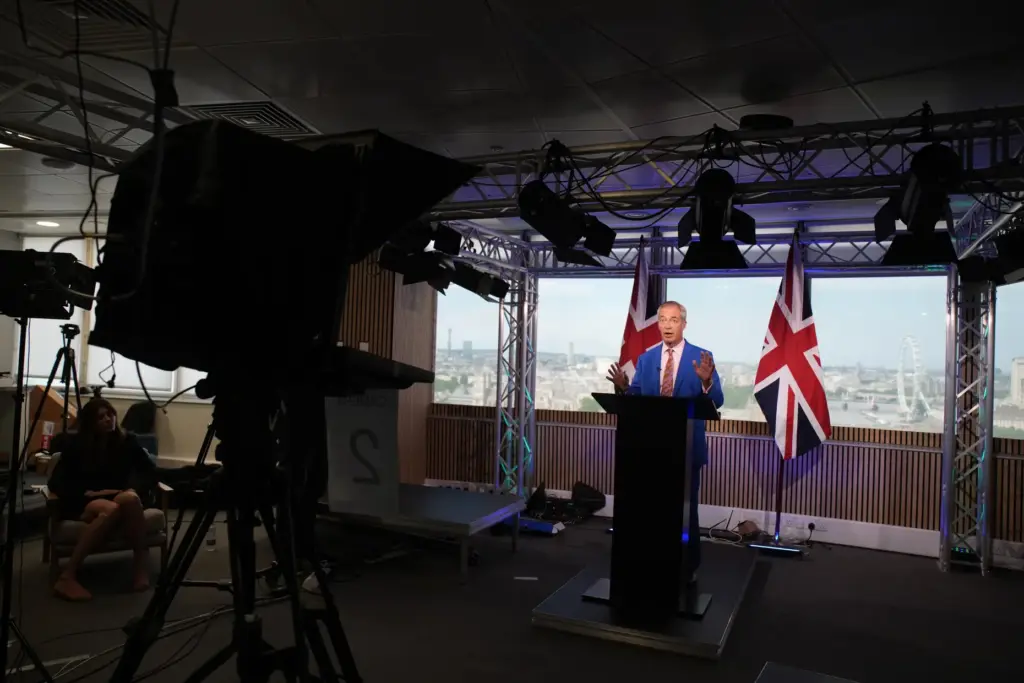 Reform UK leader Nigel Farage makes a statement to the media.