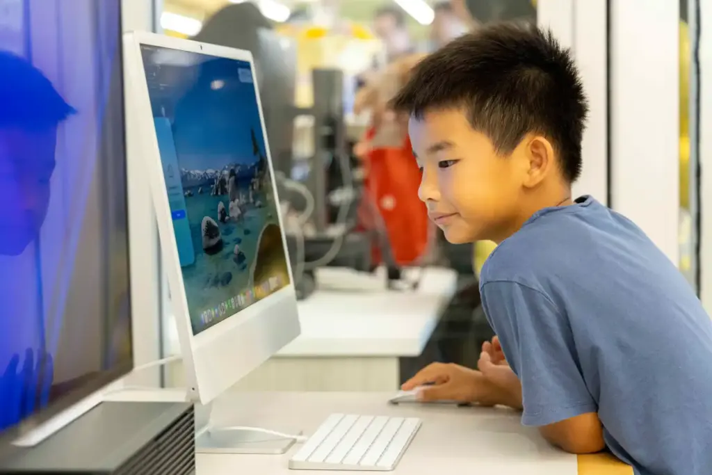 Jonathon Le, 8, uses a computer in the Innovation Lab...