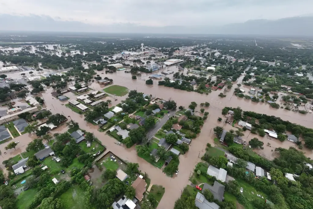 This aerial photo provided by David Fry shows flooding in...