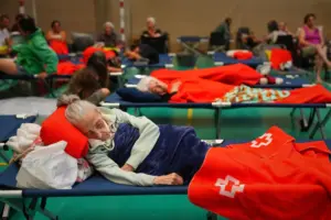 More than 200,000 people flee raging wildfires in France and Spain, some escaping by boat