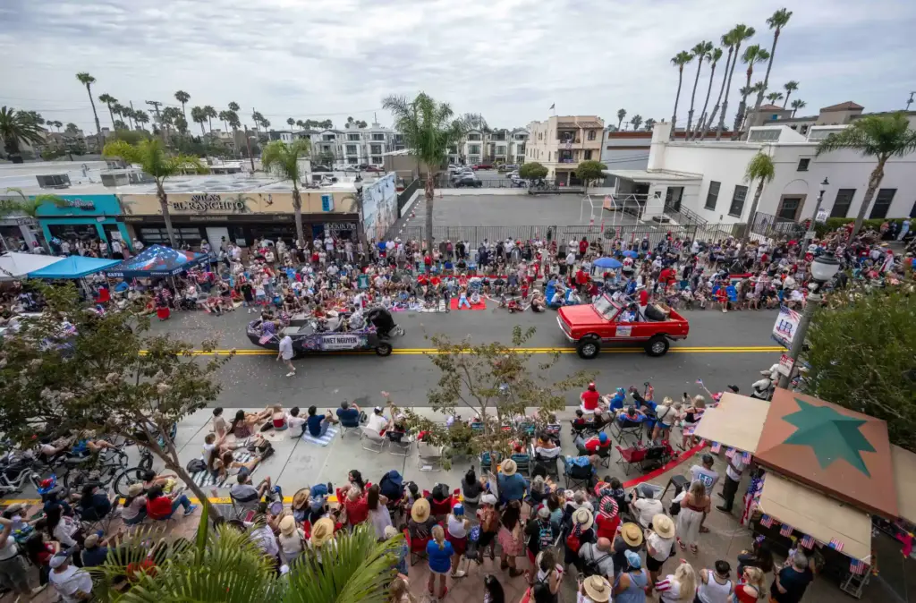 Thousands line the street and sidewalks on Main Street in...