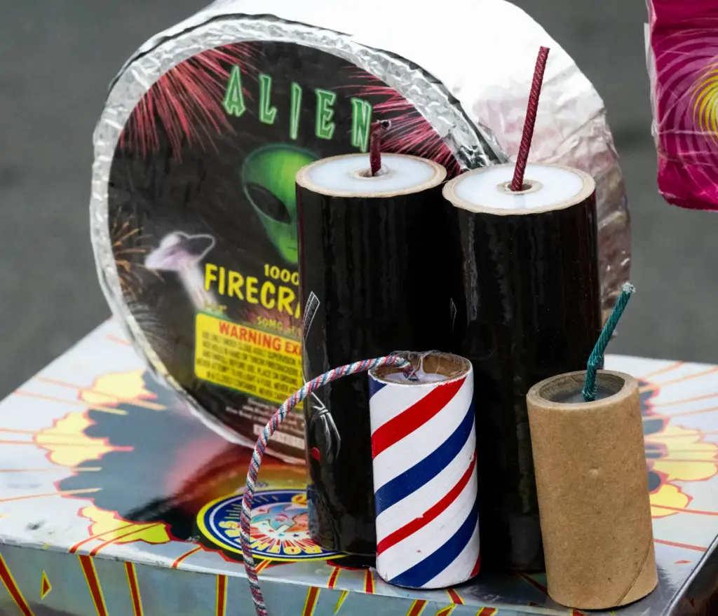 Officials display illegal fireworks during a press conference at the...