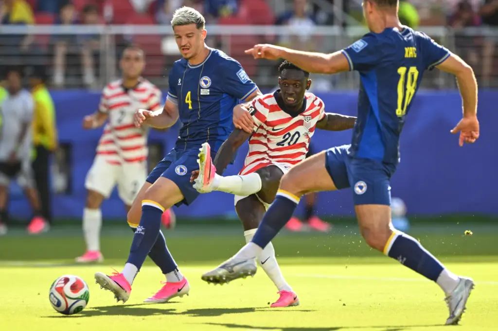 The United States’ Folarin Balogun (20) scores the opening goal...