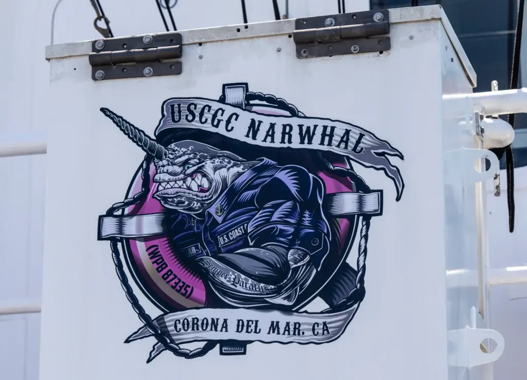 The unit crest of the US Coast Guard cutter Narwhal,...