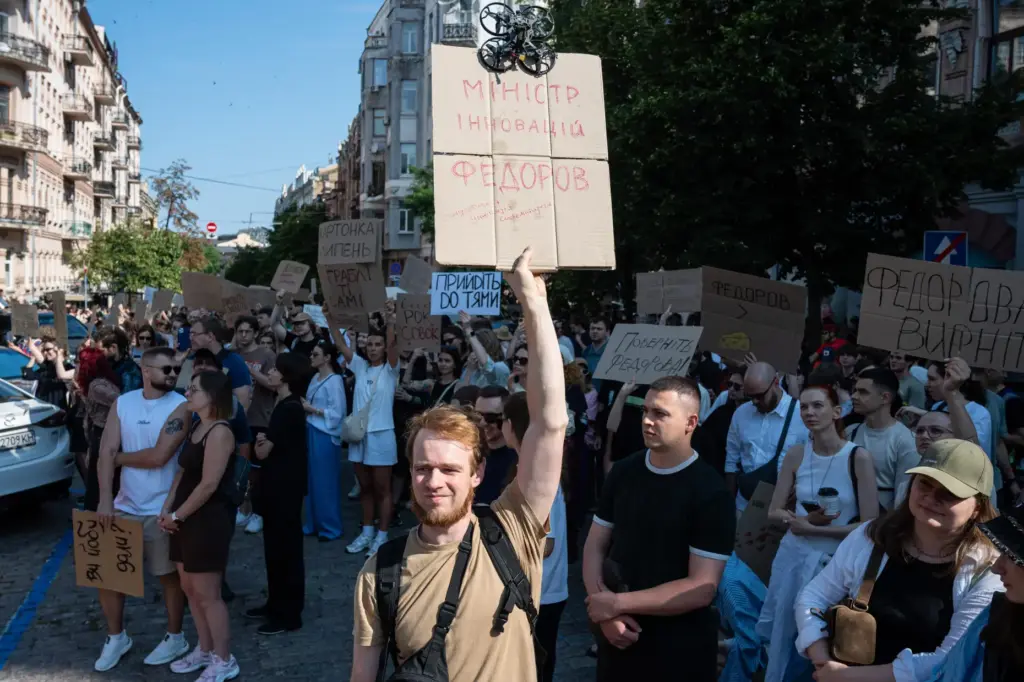 Ukrainians gather to denounce President Volodymyr Zelenskyy’s decision to dismiss...