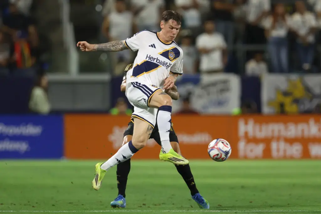Galaxy forward Robert Taylor kicks the ball during the second...