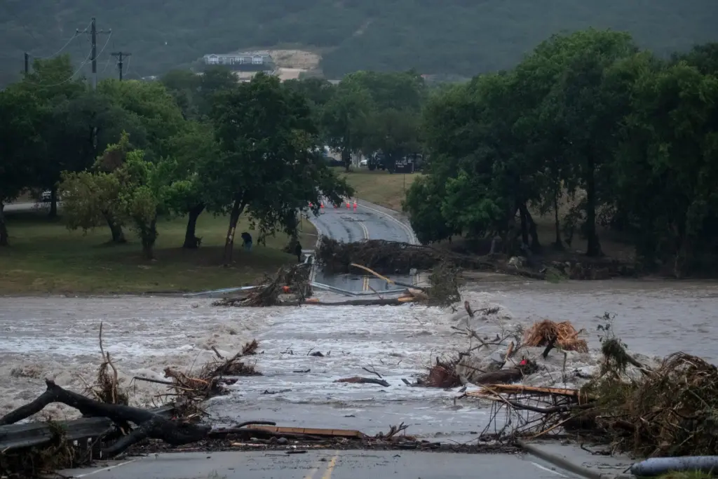 Flooding blocks off G Street along the Guadalupe River on...