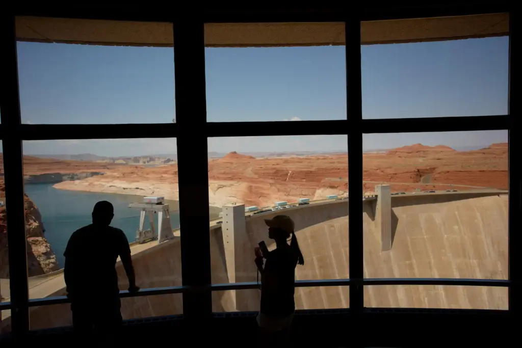 People look at the Glen Canyon Dam, Tuesday, July 14,...