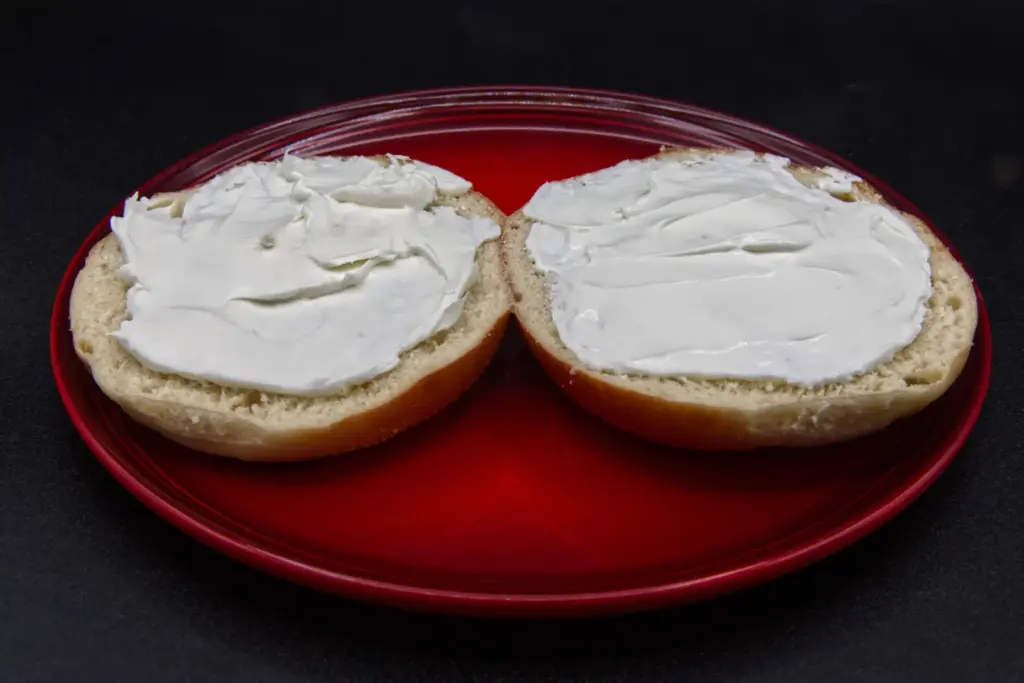 A plain bagel with cream cheese is photographed in Phoenix,...