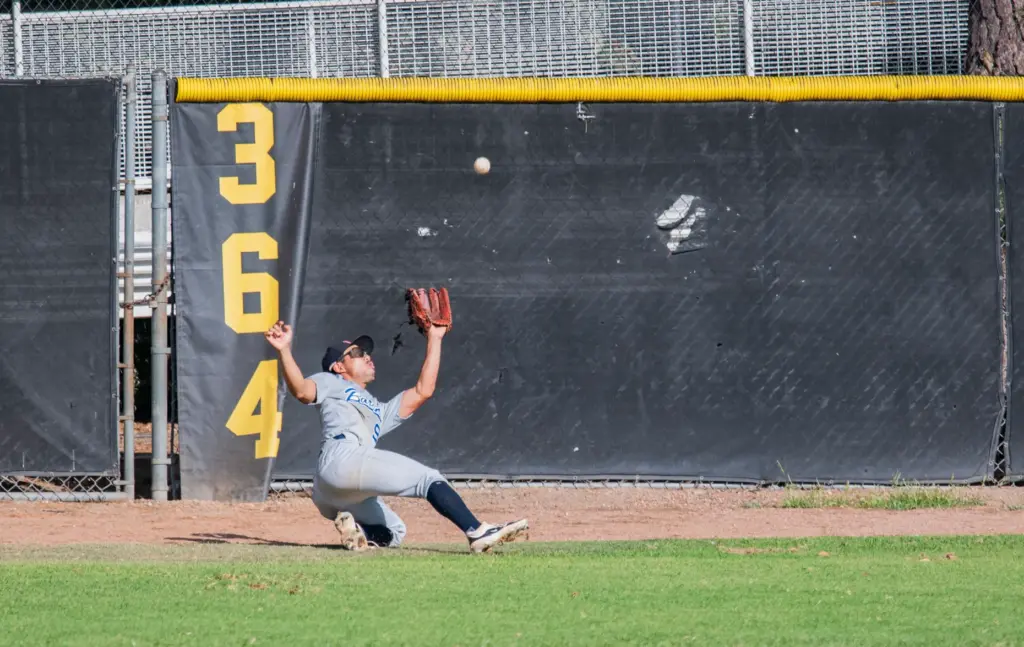 MLB Academy Barons center fielder Eiji Sawamura falls to the...