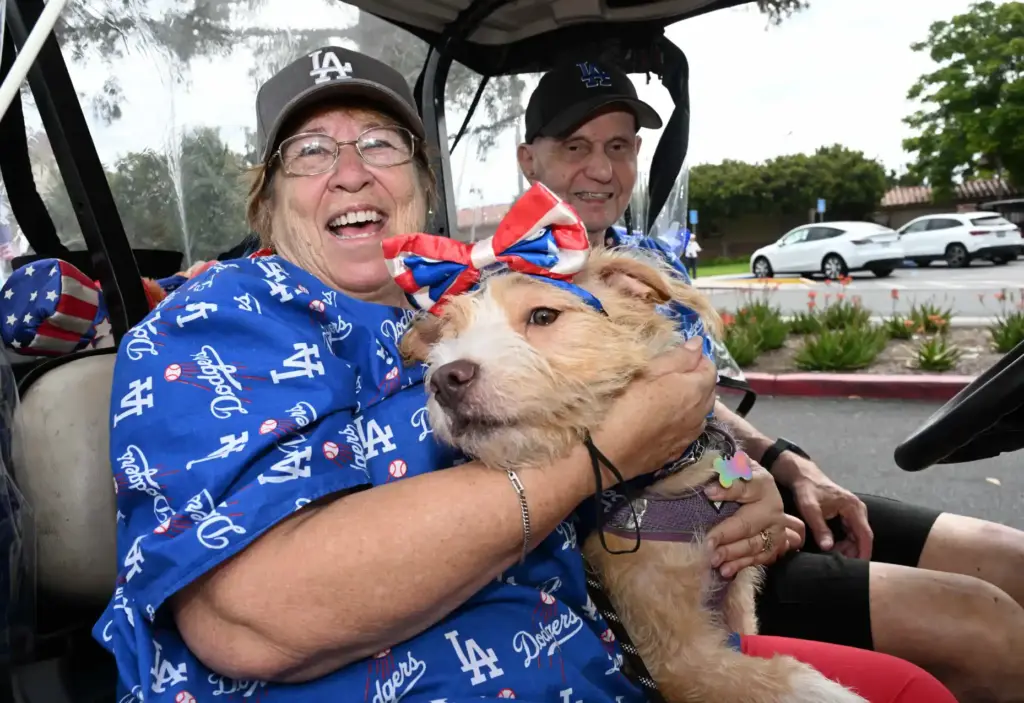 Karen Sinderman holds Terri, her 2-year-old Lucas Terrier as she...