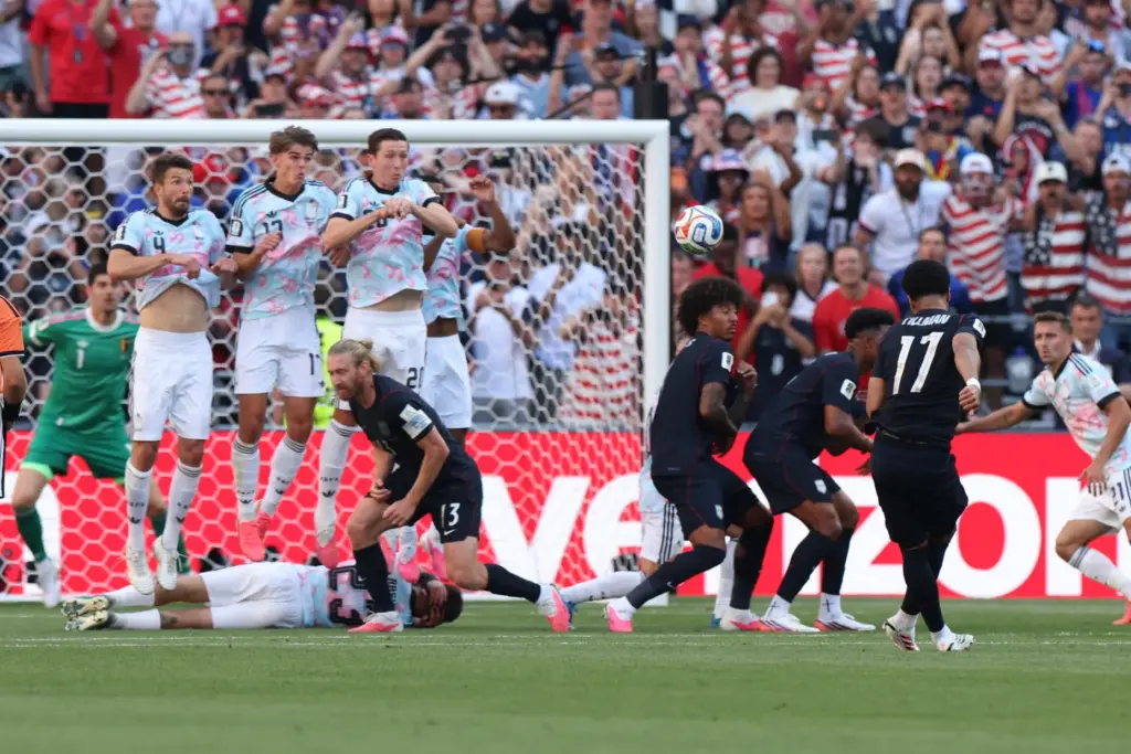 United States’ Malik Tillman (17) scores his team’s first goal...