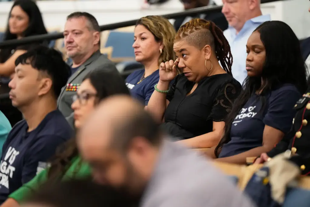 People react during an oversight forum on Friday, July 24,...
