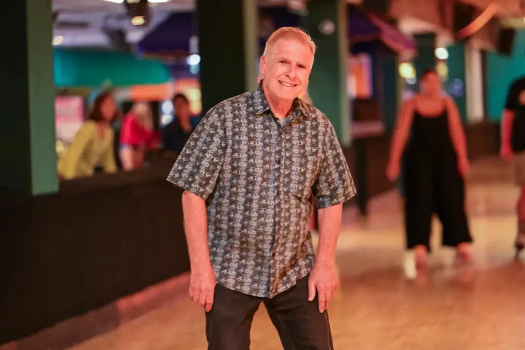 Donald Telford, owner of Holiday Skate Center, cruises around the...