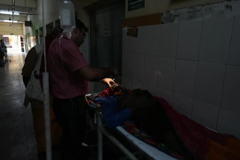 Dr. Abhishek Pranayami examines a patient suffering from a heat-related...