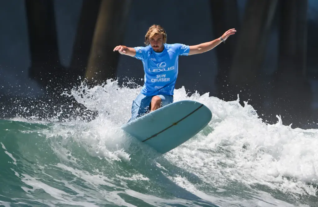 Tommy Coleman competes in the U.S. Open of Surfing Longboard...