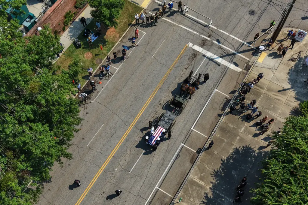 The casket of the late Sen. Lindsey Graham, R-S.C., is escorted to First Baptist Church.