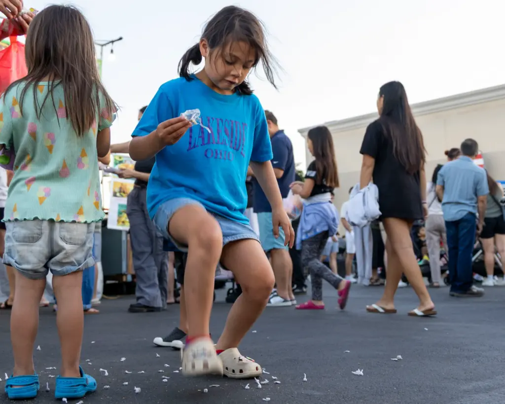 Dakota Fox, 7, stomps on bang snaps during the Night...