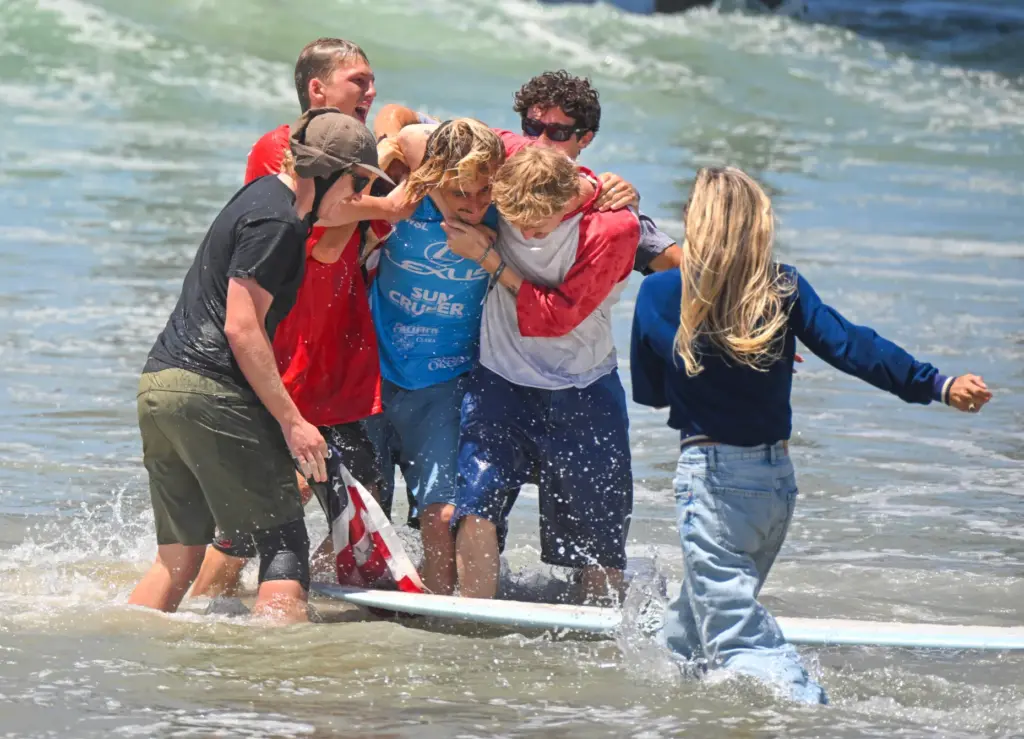 Tommy Coleman celebrates after winning the U.S. Open of Surfing...