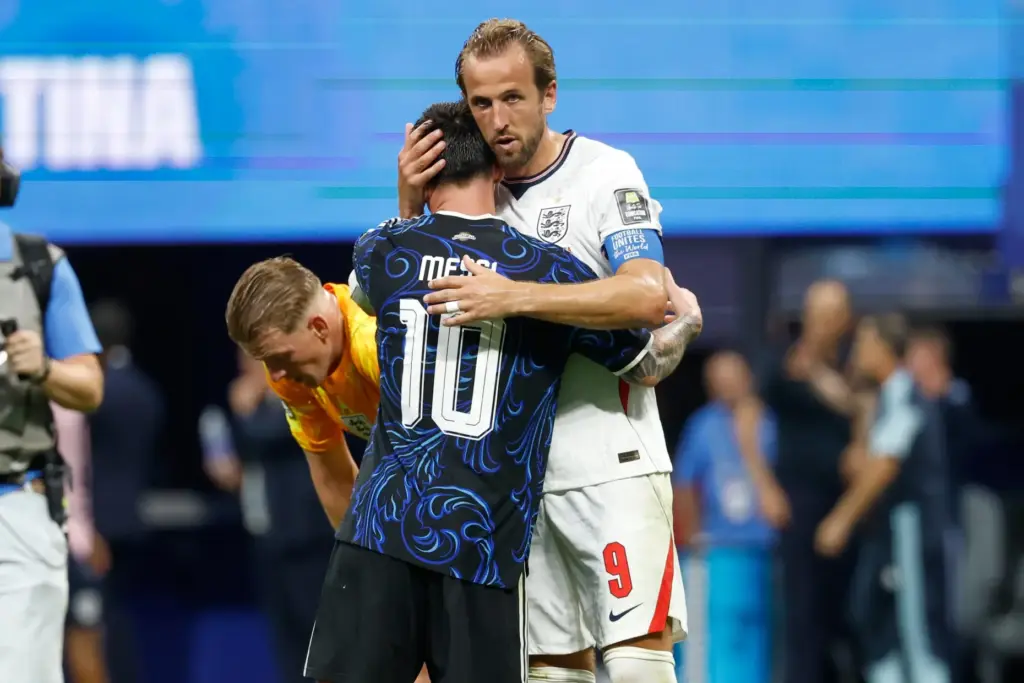 Argentina's Lionel Messi and England's Harry Kane embrace after the World Cup semifinal.
