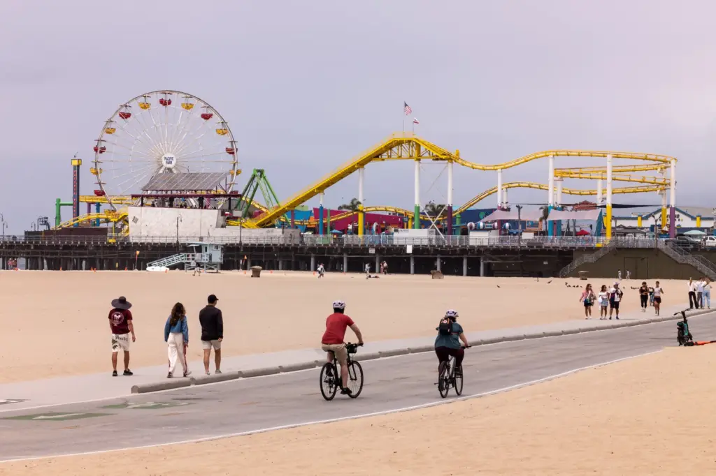Beachgoers enjoy mild temperatures near the Santa Monica Pier on...