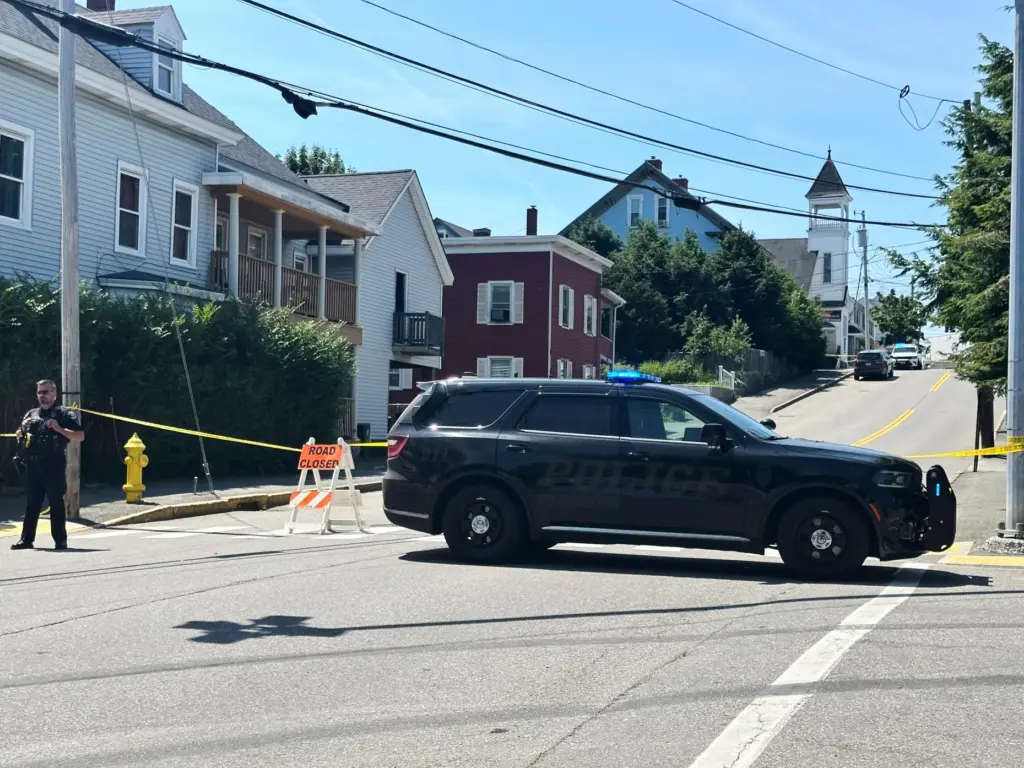 Police block a road after a shooting in Biddeford, Maine,...