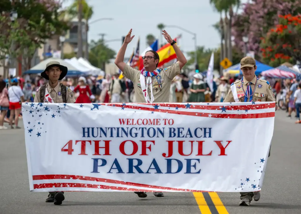 Boy Scout Troop 271 leads the way along Main Street...