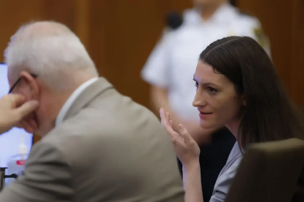 Defendant Lindsay Clancy awaits the start of proceedings during her murder trial.