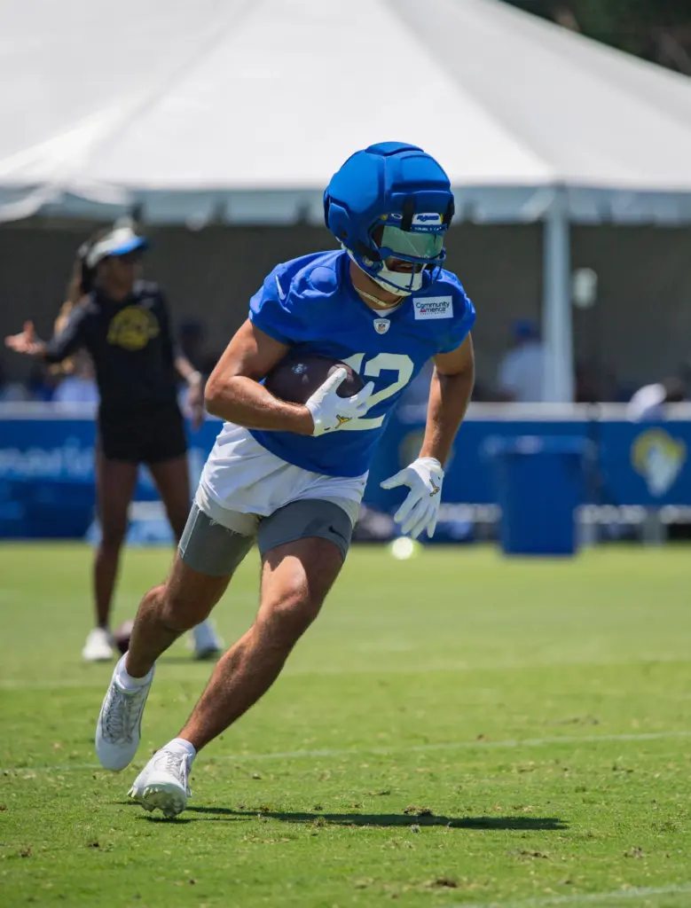 Los Angeles Rams wide receiver Puka Nacua runs with the...
